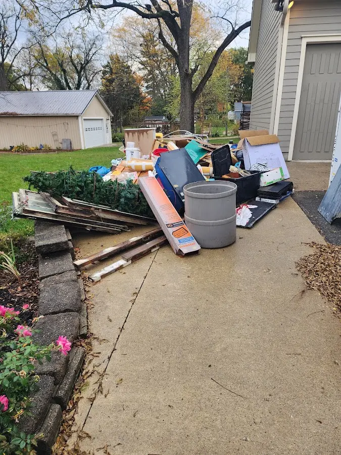 Dumpster being loaded with debris for 3 Yard Dumpster Rental in Lutherville